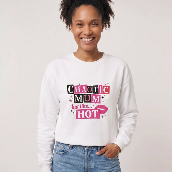 Kiksy white sweatshirt featuring a pink and black Chaotic Mum but like HOT graphic print worn by a smiling woman