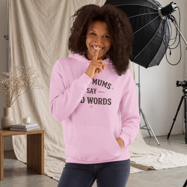 Kiksy light pink hoodie with Good Mums Say Bad Words printed on the front worn by a smiling woman