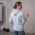 Kiksy sky blue organic cotton hoodie for women featuring gentle parenting slogan printed on back.