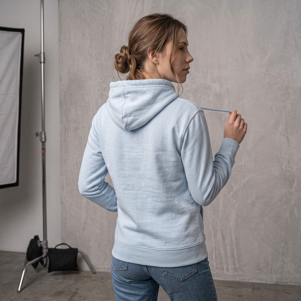 Kiksy sky blue organic cotton hoodie for women featuring gentle parenting slogan printed on back.