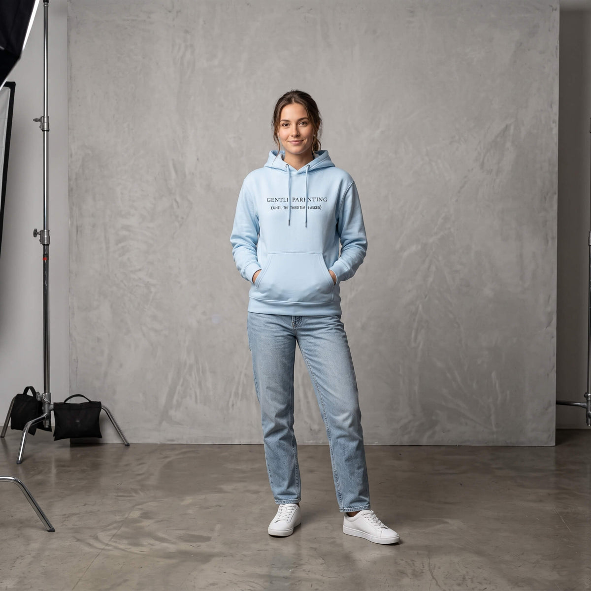 Kiksy sky blue organic cotton hoodie for women featuring gentle parenting slogan printed on front.