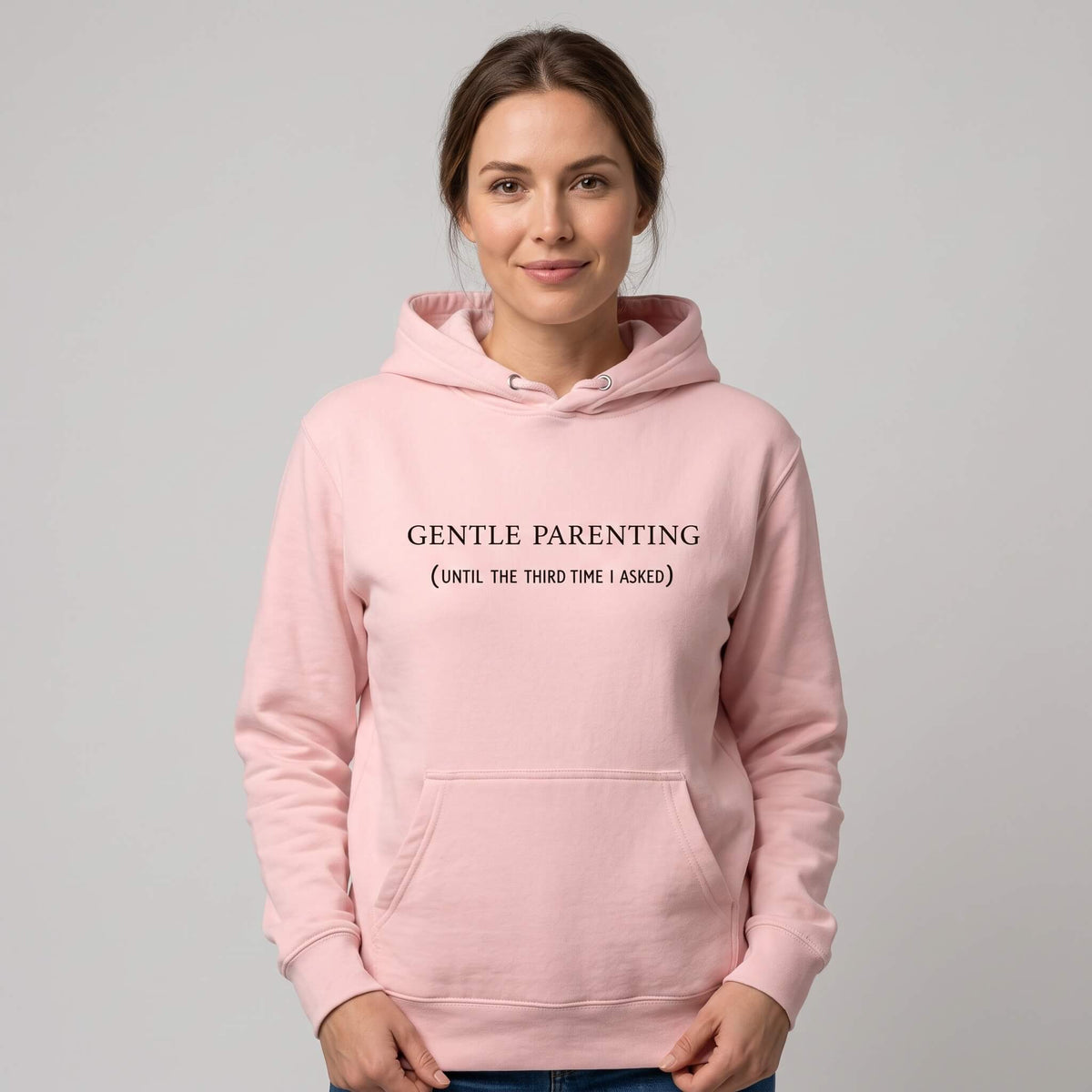 Kiksy light pink organic cotton hoodie for women featuring gentle parenting slogan printed on front.