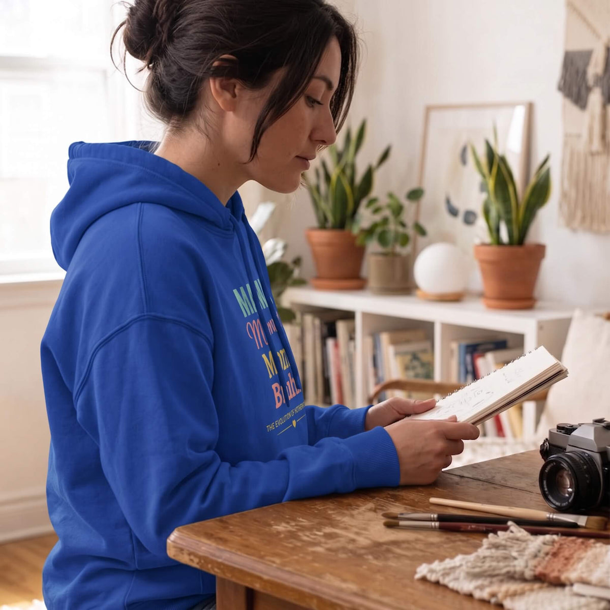 Kiksy royal blue mom hoodie featuring the print Evolution of Motherhood Mama Mommy Mom Bruh on soft fleece fabric.