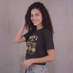 Kiksy black cropped t-shirt for women featuring a graphic print that reads Mum's Match Day Survival Club.