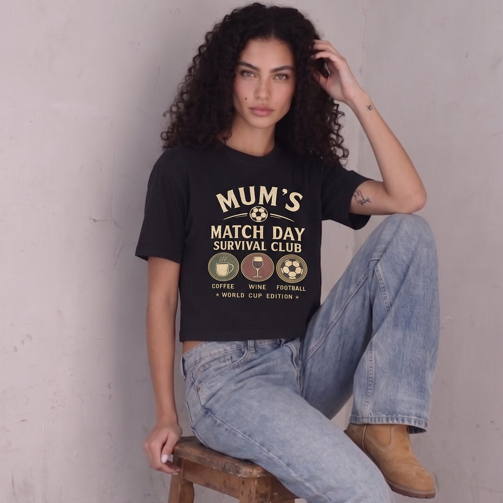Kiksy black cropped t-shirt for women featuring a graphic print that reads Mum's Match Day Survival Club.