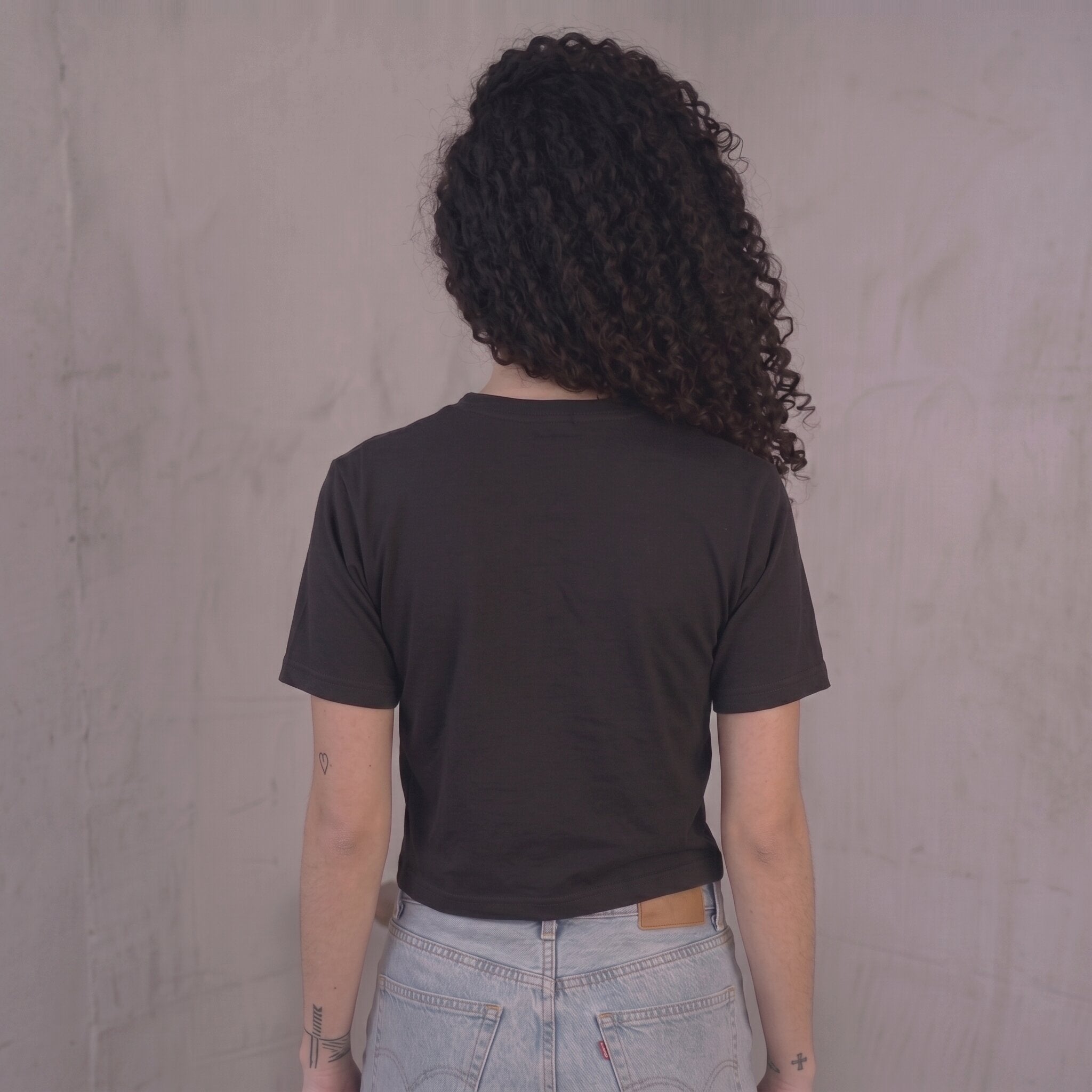 Kiksy black cropped t-shirt for women featuring a graphic print that reads Mum's Match Day Survival Club.