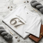 Woman wearing Kiksy white relaxed slogan t-shirt featuring Please Don't Say 67 print folded