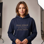 Woman wearing Kiksy dark blue hoodie featuring the text Proud Sponsor of a very messy LIVING ROOM