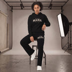 Kiksy black wide leg mama joggers with white side stripes and collegiate print, worn by a smiling model in a studio.